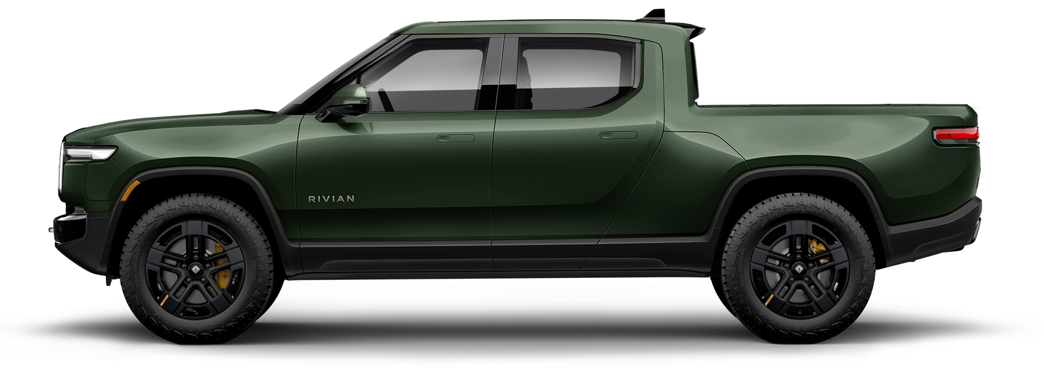 Green Rivian electric pickup truck showcasing our EV expertise